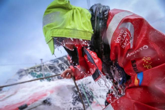 Onboard Dongfeng Race Team - Damian Foxall ducks his head to avoid getting salt water in the face - Leg five to Itajai -  Volvo Ocean Race 2015 © Yann Riou / Dongfeng Race Team